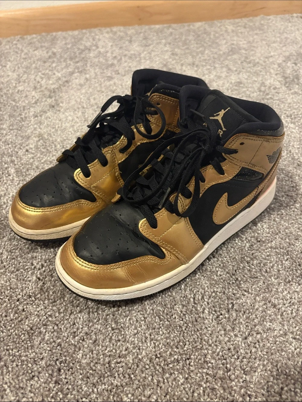 Nike Mid-Top Sneakers in Black and Gold